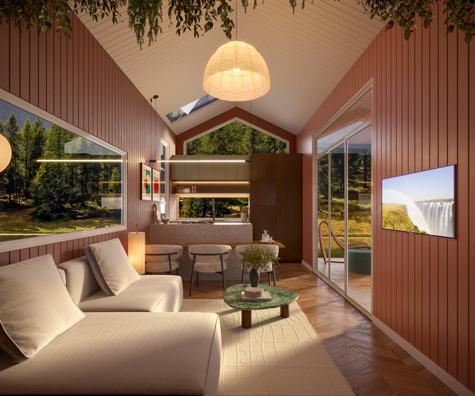 Ember living room at golden hour, looking through to the island kitchen and out to the trees